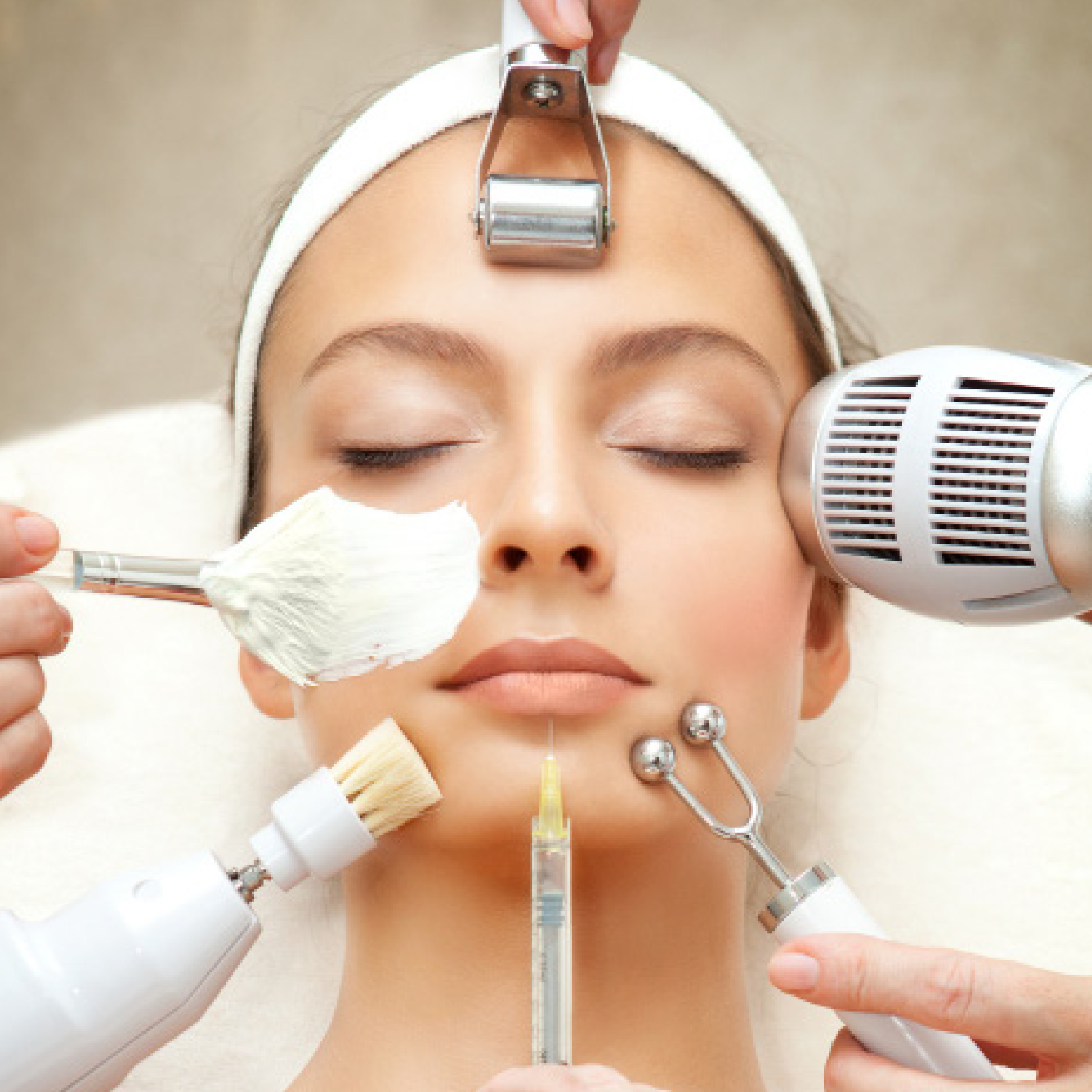 Woman receiving treatments from beauty therapists including cosmetic injections, mask facial, dermaroller, and massage