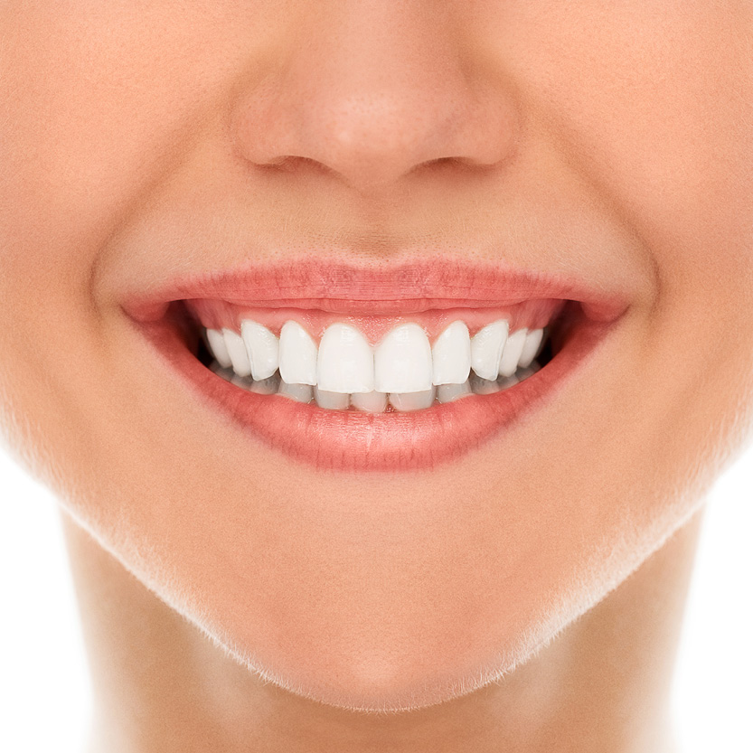 Beauty Science Teeth Grinding Close-up of a woman's smile and jawline, for teeth grinding (bruxism) and jaw tension treatment