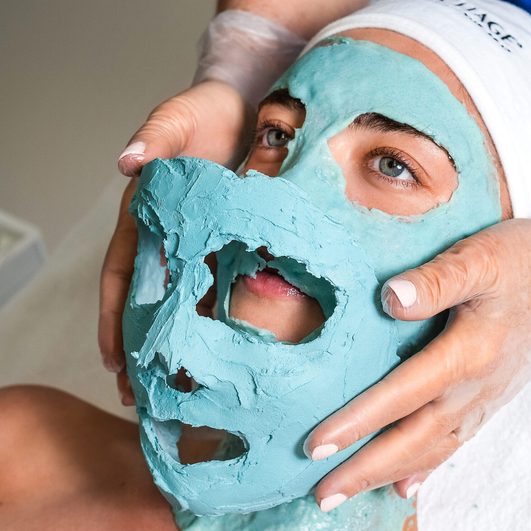 Relaxing facial treatment with a blue clay mask enhancing skin vitality and rejuvenation.